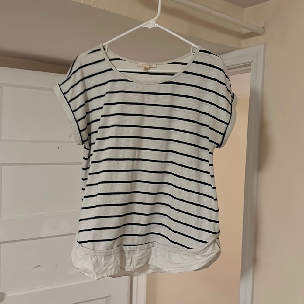 ( skies are blue) white, and black stripes, short sleeve shirt